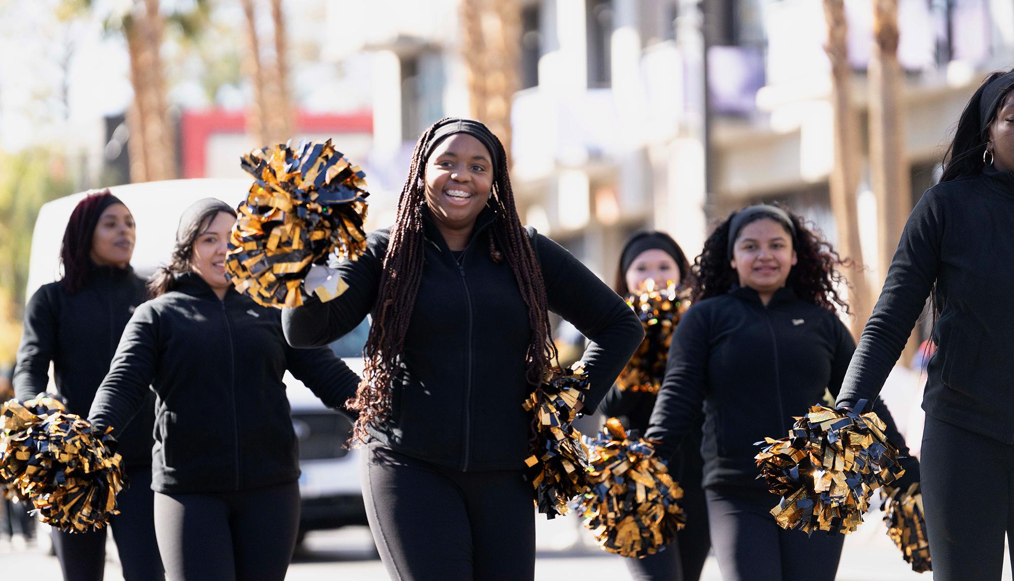 Dance Team members engaging with the crowd during a campus event, building school spirit and community connection